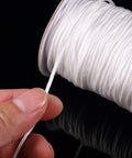 Upgraded Window Setup With This Dope Set Including 100 Clear Roman Rings And 55 Yards Of Heavy Duty White Cord For Stress Free Reweaving And Clean Modern Vibe For Quick Diy Projects Around The House - close-up of heavy-duty white cord on a spool