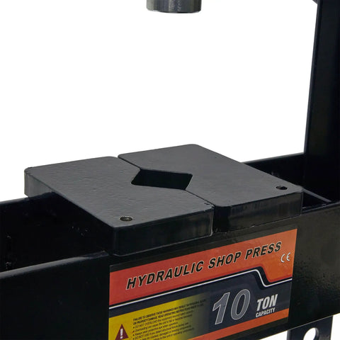 Close-up of 10 Ton Adjustable Benchtop Hydraulic Shop Press for Garage Use with metal plate and 10-ton capacity label visible.