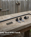 TrnAAs Outdoor Gate Bolt Drop Rod Latch Gate Hardware with Bent Control Handle and Mounting Screws Black Carbon Steel Finish Suitable for Utility Fence Gate Enclosure, 30 CM displayed on a wooden table.