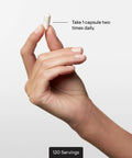 Hand holding capsule from Calcium Chelate Complex For Strong Bones With DimaCal For Enhanced Absorption And Bone Density Support bottle.