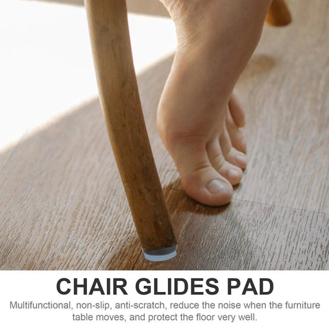 16 Piece Chair Glides For Carpet And Hardwood Floors, Heavy Duty PTFE And Iron Sliders under a wooden chair leg on hardwood