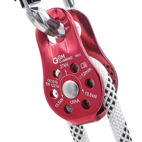 Close-up of red Fixed Micro Pulley for Climbing With 27kN Rating CE UIAA Certified Works With 12mm Rope Slack Tending Gear