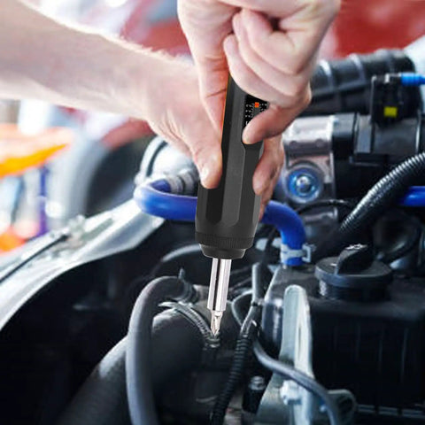 Jelquix Preset Torque Screwdriver With S2 Steel Bits And Adjustable Settings used on an engine for precise fastening during repairs.