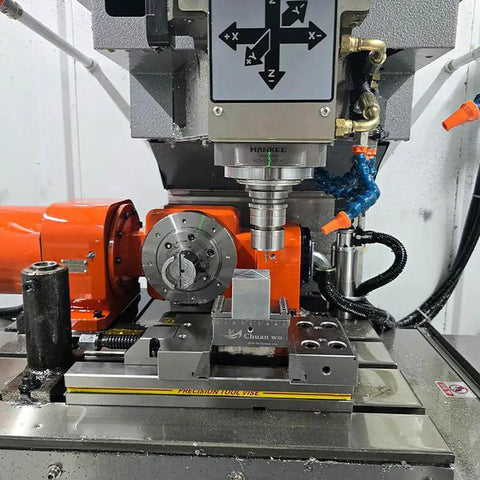 Rock Solid Self Centering CNC Vise tailored for 4 and 5 axis milling in use on a CNC machine with workpiece secured.