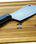 Tough As Nails Heavy Duty Stainless Steel Locking Latch Spindle Rivets For Knife Handle Assembly And Custom Knifemaking Projects next to a knife.