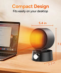Compact 600W Desk Heater With Ceramic Core emitting warm glow next to laptop, showing dimensions of 5.4 in D, 5.3 in W, 7.8 in H.