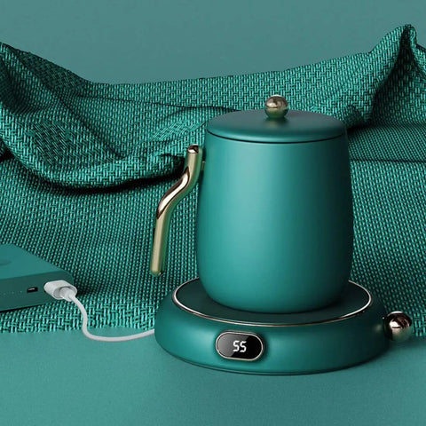 Keep Your Morning Brew Nice And Toasty With This USB Coffee Mug Warmer Featuring Three Adjustable Heat Levels Dial Knob Control Splash Resistant Build Eight Hour Safety Timer And Sleek Green Finish For Real Deal Comfort, showcasing a sleek teal mug warmer.