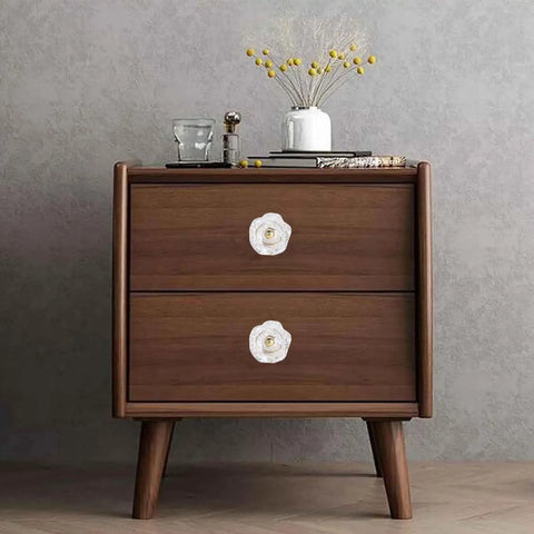 Set Of 6 Crystal Flower Cabinet Knobs In Daisy White on a wooden dresser in a modern room setting