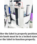 Close-up of the locking knob on the Fast Track Automatic Desktop Conveyor Round Bottle Labeler for 4 to 10 cm bottles.