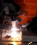 Close-up of PT31 Plasma Cutter Torch 13ft High Frequency Cutting Torch For Cut-45 Cut-50 in action, sparks flying during metal cutting.