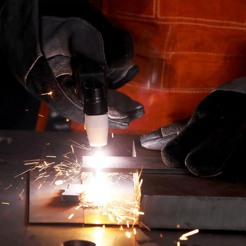 Close-up of PT31 Plasma Cutter Torch 13ft High Frequency Cutting Torch For Cut-45 Cut-50 in action, sparks flying during metal cutting.