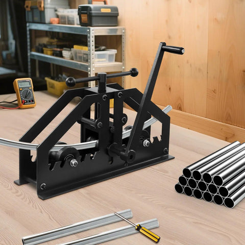 Heavy Duty Manual Tube Roller Bender With Ergonomic Handle For Rolling Round Steel Pipe Up To 1.5 Inches on workshop bench with metal pipes.