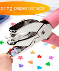 4 Pack Handheld Hole Punch Set With Heart, Star, Large Circle And Medium Circle Shapes, Rubber Grip, shown with punched shapes in tray
