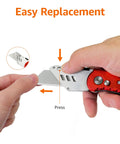 Side view of Amazon Basics red aluminum folding utility knife; blade extended, back-lock visible.