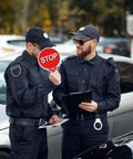 Two Sided Stop And Go Handheld Sign Kit With Handle Waterproof Plastic Traffic Sign held by uniformed personnel.