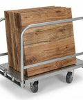 Heavy Duty Platform Cart With 2500 Lb Steel Board Three Sided Rail Guards Four Swivel Casters loaded with wooden panels for moving.