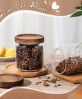 24 Pack Glass Canister Set With Tight Wood Lids For A No Sweat Pantry Setup, 17 Oz Food Jars with coffee beans on display.