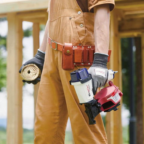 Badass Heavy Duty Roofing Nail Gun Built With Heat Treated Alloy Nose For Serious Shingle Installations and Residential Builds that Delivers Sick Performance on Every Busy Job Site Project held by worker in glove.