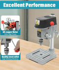 Compact Mini Benchtop Drill Press With Variable Speed Control Up To Sixteen Grand and Quick Change Collar for Power Drills on workbench.