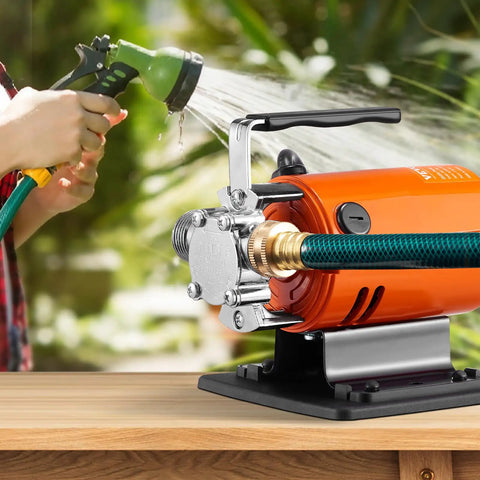 Portable Electric Water Transfer Pump 360 GPH 46 Ft Max Head 115V Utility Pump With Hose Kit shown in use watering plants.