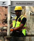 Heavy Duty Ansi Class Two High Visibility Safety Vest With Nine Pockets And Reinforced 360 Degree Reflective Strips Built Like A Tank For Construction Crews Who Need To Shine Bright And Crush It On The Daily Without Any Sweat, worn by a worker using tools.