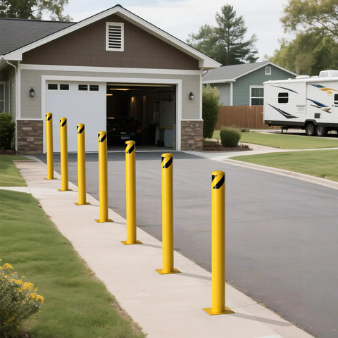Rock Solid 2 Pack Carbon Steel Security Bollards, Heavy Duty 42 Inch Parking Barrier Posts in yellow near a garage.