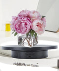 Stylish Electric Rotating Jewelry Display Turntable With Adjustable Direction And 360 View For Home Studio Showcase with flowers.