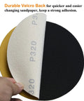6-inch no-hole hook-and-loop sanding discs, 320-grit; white abrasive face peeling to reveal yellow backing, set of 3.