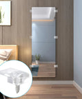 Clear Mirror Holder Clips Kit 25 Heavy Duty Acrylic Fasteners For No Sweat Wall Mounting secured to a mirror on a wall.