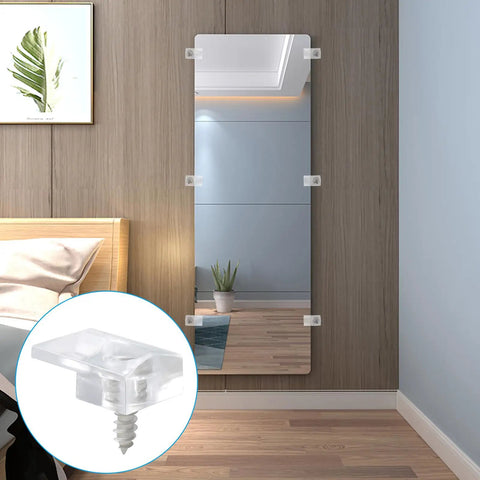 Clear Mirror Holder Clips Kit 25 Heavy Duty Acrylic Fasteners For No Sweat Wall Mounting secured to a mirror on a wall.