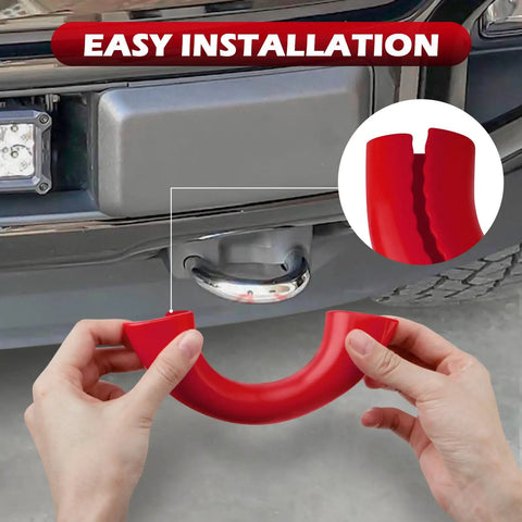 Hands fitting a red silicone Tow Hook Covers For Ford F150 2004 Through 2026 Bronco Base Big Bend Outer Banks 2021 Through 2026 And Toyota Tundra 2017 Through 2021 Compatible Accessories Red onto a vehicle's tow hook.