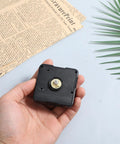 Hand holding Quartz Clock Movement Replacement Kit for Battery Powered DIY Clock Repairs, Quiet Silent Wall Clock Mechanism, black