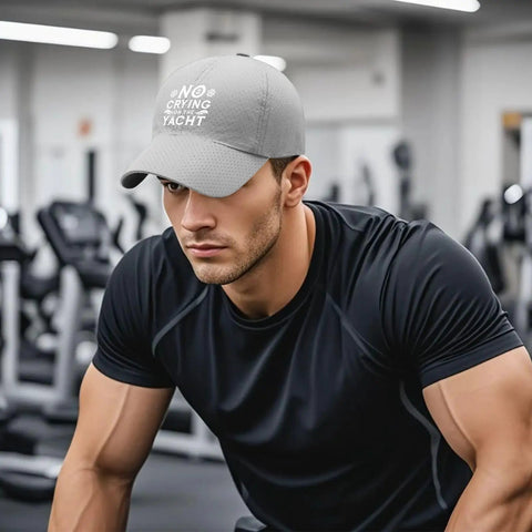 Man wearing Men's Dope Breathable Light Gray Tennis Cap, lightweight adjustable baseball hat with soft comfort in gym setting.