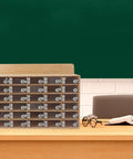 Gear Up And Lock It Down With This 30 Slot Cell Phone Locker Featuring Individual Keyed Covers in a classroom setup.