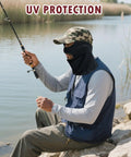 Man fishing wearing black Two Pack 3 Hole Balaclava Ski Mask For Men And Women, Dope Ultra Thin Full Face Cover, beside a lake.