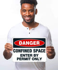 Lock Up Your Worksites With This Sick Danger Confined Space Safety Sign Solid Aluminum Permit Only Plaque Designed For Harsh Sites That Are Hella Rugged Weatherproof And Totally Built Different held by a smiling man.