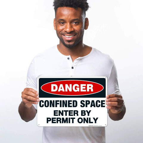 Lock Up Your Worksites With This Sick Danger Confined Space Safety Sign Solid Aluminum Permit Only Plaque Designed For Harsh Sites That Are Hella Rugged Weatherproof And Totally Built Different held by a smiling man.