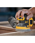 Person using 20V Max Brushless Orbital Sander Tool Only With Variable Speed Control 8000 To 12000 OPM Low Profile Body on wood
