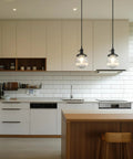 Three Light Linear Pendant Island Lighting With 5.9 Inch Globe Striped Glass Shades in modern kitchen setting