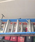 Heavy Duty Ceiling Storage Hooks For Garage Set Must Have, Overhead Rack To Hang Lumber, Ladders, Pipes, Fishing Rods, Bikes And Gear, Space Saving J Hooks, 2 Pack, Sturdy Ceiling Mounted Organizer holding a ladder