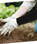 Heavy Duty Cut Resistant Arm Sleeves Built Tough For Serious Yard And Mechanic Jobs Deliver Rock Solid Forearm Protection That Truly Holds Up Through Long Days In Matte Black worn while digging in soil.