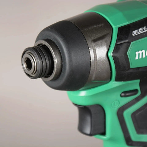 Close-up of Cordless 18V Impact Driver Sub-Compact Brushless, 1/4 In Hex, lightweight body showing metal chuck and green handle detail