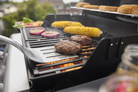 Propane Grill For Outdoor Cooking And BBQ With 2 Burners Black Finish Porcelain-Enameled Cast Iron Grates And Snap-Jet Ignition Ready To Grill Like A Pro, burgers and corn grilling
