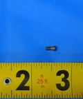 Top Shelf MS1153 Indexable Insert Retaining Screw For CNC Milling And Lathe Operations on blue background with ruler for size reference.