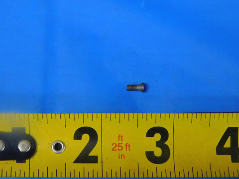 Top Shelf MS1153 Indexable Insert Retaining Screw For CNC Milling And Lathe Operations on blue background with ruler for size reference.
