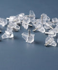 Clear Plastic Shelf Support Pins Set, 60pcs 3mm pegs with studs on blue surface, low-profile design for cabinets and bookshelves