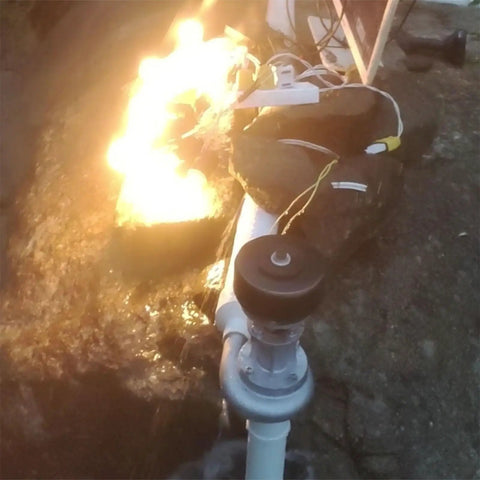 Impact Type Portable Hydropower Turbine Generator 1000W 220V for home use, shown installed by a stream with visible water flow