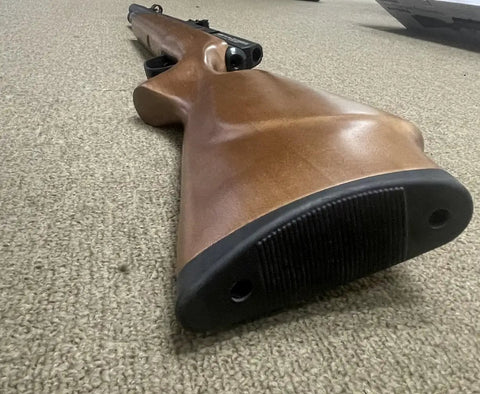 Wooden stock of Hard Hitting 25 Cal PCP Air Rifle With 3500 PSI Tank For Serious Power And Precision, Smooth Action, And Tight Groups