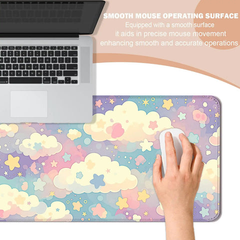Dope Colorful Cloud and Star Desk Mat in Watercolor Pink Extended Large Mouse Pad shown with laptop and hand using a mouse.