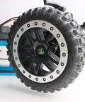 Close-up of RC car wheel with Eight Pack Flange M4 Nylon Lock Nuts With Serrated Edges in green